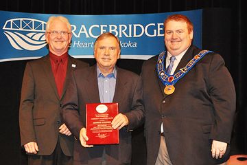 Morris Hudasek received a nomination for the 2014 June Callwood Outstanding Achievement Award and a plaque from the Town of Bracebridge.  L-R Councilor Steve Clement, Chair of Community Recognition Advisory Committee, Morris Hudasek, Mayor Graydon Smith