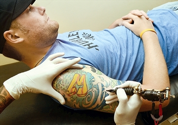 Aurora tattoo artist celebrates ancient art form
