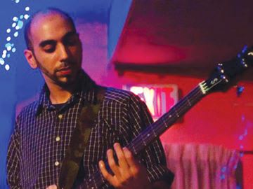 Rustom Irani in an undated photo playing bass for his former band Singh Bandana Singh.