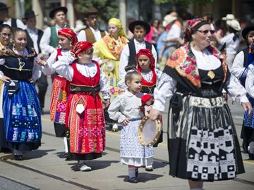 Dressed in traditional garb, members of Toronto's Portuguese community pararde along Dundas St. W. during Toronto's annual Portugal Day Parade.