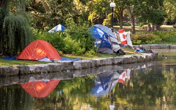  Tents that are part of a homeless encampment sit on Roos Island in Victoria Park in Kitchener.