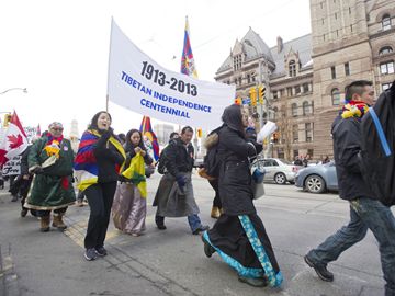 Supporters of Tibetan independence march on Queen Street Wednesday morning for a celebration rally to mark the 100th anniversary of Tibetan Proclamation of Independence. (Feb. 13, 2013)