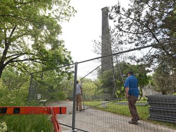 A portion of Goldie Mill is fenced off after the City of Guelph reported chemical contaminants were found in the soil at the site. The fencing around the containment area was extended on Wednesday morning.