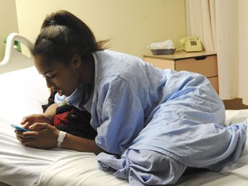 Tayjana McGhie-Betty keeps in touch with friends and family before going into the operating room at The Hospital for Sick Children to repair a valve in her heart.