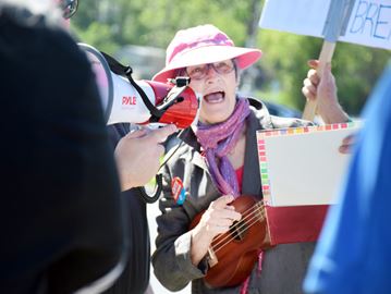 Cobourg resident Marie-Lynn Hammond performed a song during a previous rally outside MPP David Piccini’s office. The musician will lead attendees of a protest at the MPP’s office Friday, Nov. 18 in ‘stirring songs of protest.’