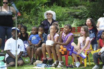 Children react to a performer at the Best of Weston Multicultural Festival Saturday at the Little Avenue Memorial Park.