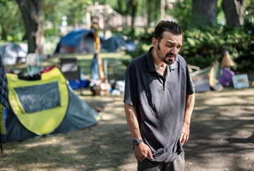 John Taves talks Friday about being homeless and living on Roos Island in Victoria Park in Kitchener.