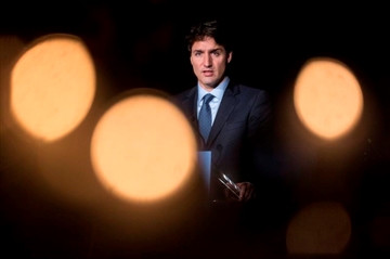 It's not Ottawa's role to challenge a new Quebec law that forbids people from receiving government services with their faces covered, Prime Minister Justin Trudeau said Thursday during a visit to the province. Prime Minister Trudeau attends the UJA Federation of Greater Toronto International Leadership Reunion at Toronto's Royal Ontario Museum on Wednesday, October 18, 2017. THE CANADIAN PRESS/Chris Young