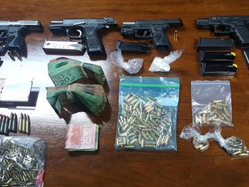 Durham police seized guns, ammunition and drugs as a result of an investigation into trafficking in Durham and throughout the GTA. Three people were charged.