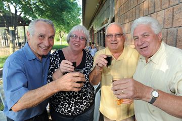 Joe and Rose Sunseri join with Vince Votta and Vito Bartucca in raising a toast to the long weekend.