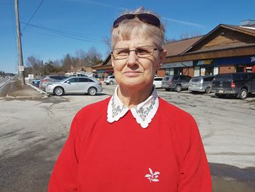 Jackie Hinds, 68, stands at the corner of Highway 27 and Finlay Mill Road in Midhurst, where her daughter Cindy Halliday was last seen April 20, 1992.