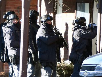 A police negotiator from Durham Regional Police’s Emergency Response Unit speaks with a barricaded man inside a Rubidge Street home on Sunday (March 5) morning.