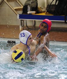Northview Heights Secondary School's Vania Sobolev, left, tries to get a shot past Georges Vanier Secondary School netminder Emil Sanathirajah during high school boys' waterpolo action at Northview Pool on Thursday afternoon. Northview went on to win the game 14-9. (May 9, 2013)