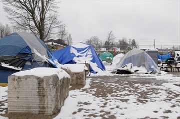 The homeless encampment at the corner of Victoria and Weber streets is blanketed in snow on Nov.16. 