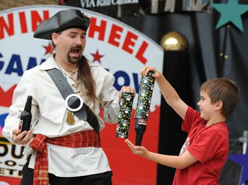 Nine-year-old Ryan gives Captain Corbin a lesson in magic.