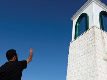 OSHAWA -- Siraj Patel pointed at a window at the Oshawa Islamic Centre that was reportedly shot at with what is believed to be a pellet gun. August 2, 2016.