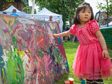 Three-year-old Chu Han Fu gets artistic during the fourth edition of Roncy Rocks! in Roncesvalles Village. (June 15, 2013)