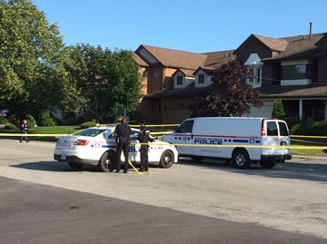 PICKERING -- Police officers guard the scene in the Glenanna Road and Huntsmill Drive area after a man in his 20s died of stab wounds. Police were called to the scene at about 2:30 a.m. Thursday morning.