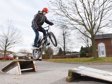 OSHAWA -- Lawrence Kozak, 14, rode his new BMX bike outside his home. Lawrence's bike was stolen in October and after an Oshawa This Week story about it, there was an outpouring of support from the community including an anonymous donor buying him this new bike. November 17, 2017.