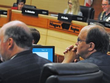 Andy Petrowski, right, makes a brief appearance at regional council on Thursday night after taking a personal leave.