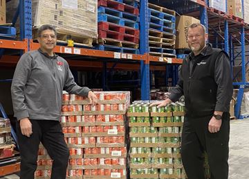 Canadian Tire Cobourg has made a $5,000 donation to the Food 4 All warehouse. Pictured are Canadian Tire Cobourg
associate dealer Peter Puglia, left, and Rob O’Neil, Northumberland County food security services manager.