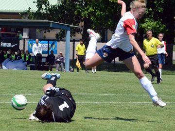 London Gryphons Lauren Winquist can’t beat Laval Comets goaltender Genevieve Richard to the ball during Saturday’s (May 25) W-League game at the North London Fields.