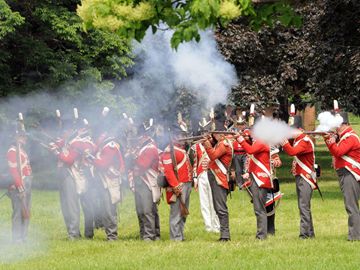 British troops return fire in defence of Fort York against the advancing American forces during the War of 1812 re-enactment of the Battle of York in 1813.