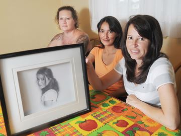 OSHAWA -- Rachel Russell's friend Genny Barnes, left, and sisters Cindy Russell and Shelley Russell hope someone will come forward to solve the mystery of Rachel's death. On Nov. 12, 2007 Rachel Russell was found murdered on a Cobourg path along the east-west train tracks that are commonly travelled by people heading between Ontario and Division streets.