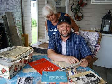 Tamara and her son Brad Carson look over some of the documents, including the operating manual, related to a 1957 BMW 507 Series II Roadster that her late father once owned. They learned the car was sold to a Bowmanville man at a U.S. auction for $2.315 million.