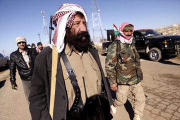 Kurdish fighters push into Sinjar town; Iraq forces battle Islamic.