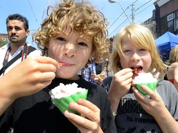 Reid and Sander Miller-Murphy sample some Italian Gelato on College St. Saturday afternoon for a Taste of Italy.