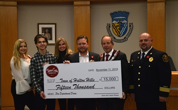 Darien Brass, Austin Brass, Jane Brass, Jason Brass, president of Terra Cotta Cookie Company, Mayor Rick Bonnette, and assistant deputy chief, Bryce Marshall. The Brass family donated $15,000 to the Town of Halton Hills for the purchase of a drone to be used by the Fire Department. Nov. 12, 2019