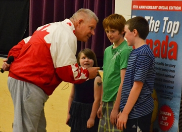 Muskoka Beechgrove Public School students, left to right, Kara Claude, Jacob Loader, and Wesley Verge, took a little advice from motivational speaker Chris Robertson during a presentation at the school on May 27.