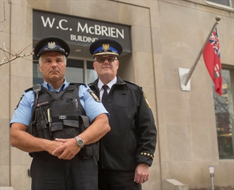 Bill Perivolaris, a long-time TTC special constable, performed first aid at the scene Monday. He is pictured with Mike Killingsworth, head of transit enforcement at the TTC.