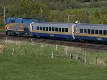 A VIA train makes it way through the countryside.