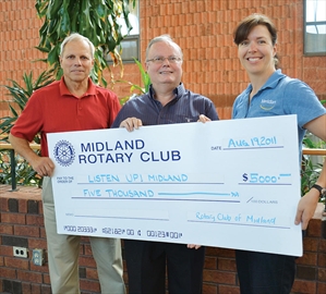 Ron Crane, John French, Susan Hrickovian. Midland Rotary Club donates $5,000 to Brookside Music Assocation