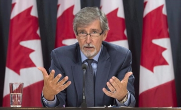 Privacy commissioner Daniel Therrien responds to a question during a press conference Tuesday September 27, 2016 in Ottawa. Canada and the United States have begun sharing information about suspected terrorists under a revamped agreement even though the federal privacy watchdog is still studying the possible risks for Canadians. THE CANADIAN PRESS/Adrian Wyld