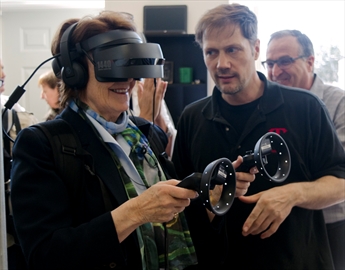 Lincoln Mayor Sandra Easton tries out a virtual reality system created by TReality. The startup utilized services from Spark Niagara to get connected with other larger technology companies. Spark Niagara launched its Beamsville location on Monday.