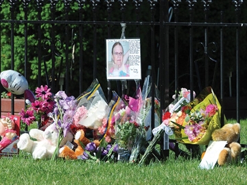 OSHAWA -- Flowers and cards were left at the scene following the murder of 89-year-old Alletta Rusnell. Ms. Rusnell was killed early June 2 following an altercation with a neighbour in their Wayne Avenue apartment building. June 4, 2013.