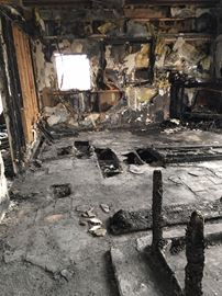 The aftermath of a deadly fire at 725 Quaker Rd., in Oakwood, where two people died in February.