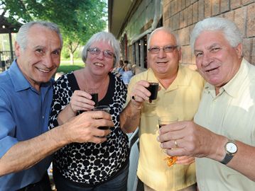 Joe and Rose Sunseri join with Vince Votta and Vito Bartucca in raising a toast to the long weekend.