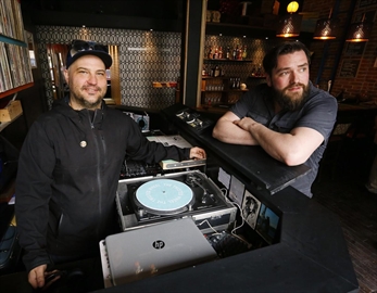 Co-owners Jonathan Hall, left, and Mike Judson take a break inside their new bar Twisted Wheel on Thursday May 3, 2018 on Water Street. Mr. Hall died Friday, March 22, 2019.